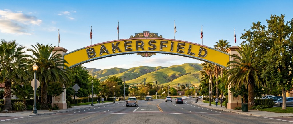 Bakersfield arch with green hills
